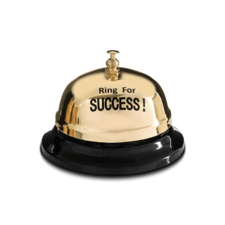 Stalo skambutis „SUCCESS“