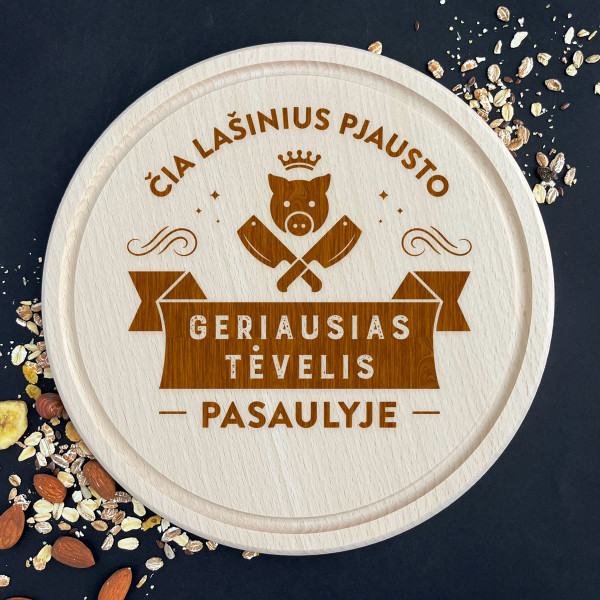 Graviruota apvali pjaustymo lentelė "Čia lašinius pjausto geriausias tėvelis" Graviruota apvali pjaustymo lentelė "Čia lašinius pjausto geriausias tėvelis"