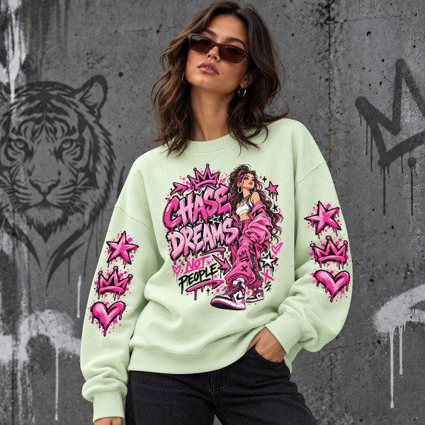 Unisex pastelinis džemperis "Chase dreams, not people"